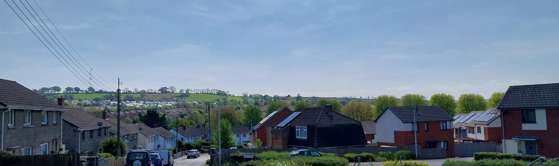 A road going past houses on a housing estate