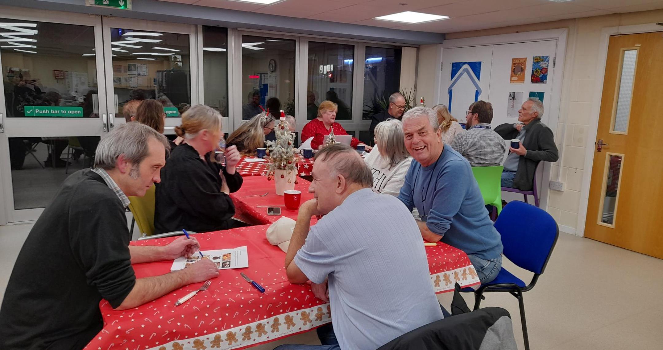 a group of people sat around tables