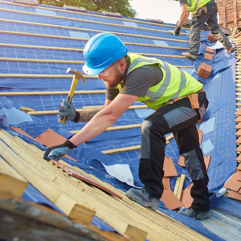 Roofer working on a new build house