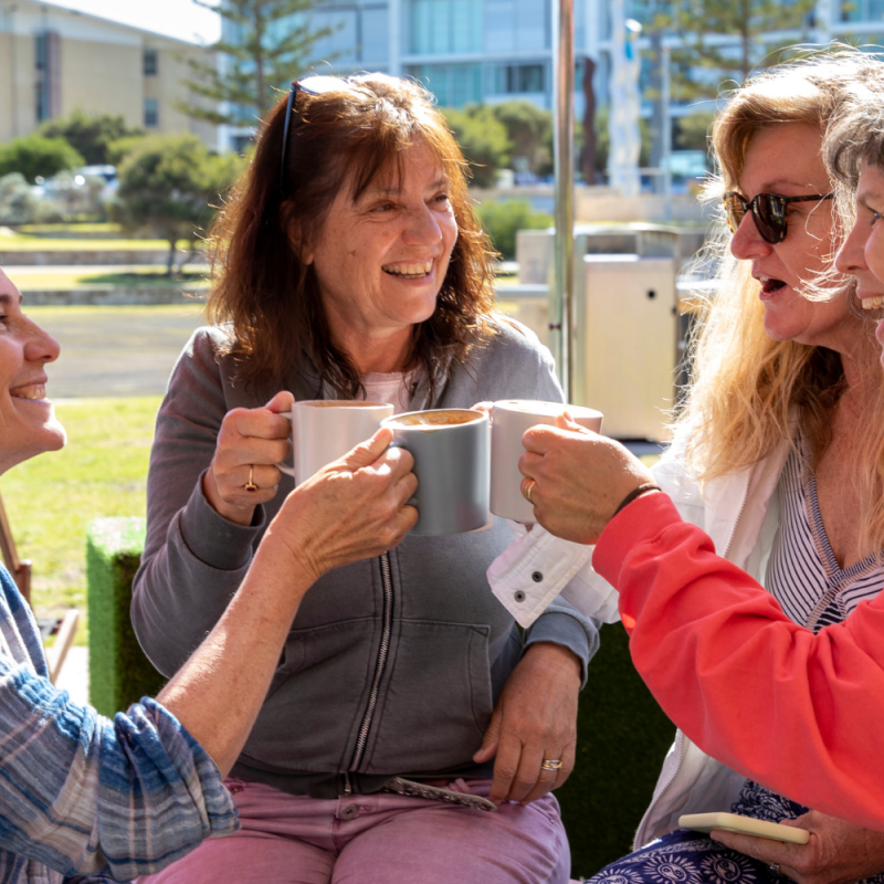 Four ladies having coffee together