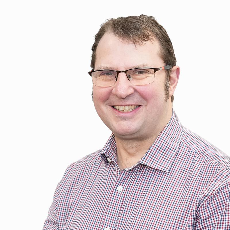 Marc Rostock; Director of Neighbourhoods; smiling man in glasses, purple checked shirt
