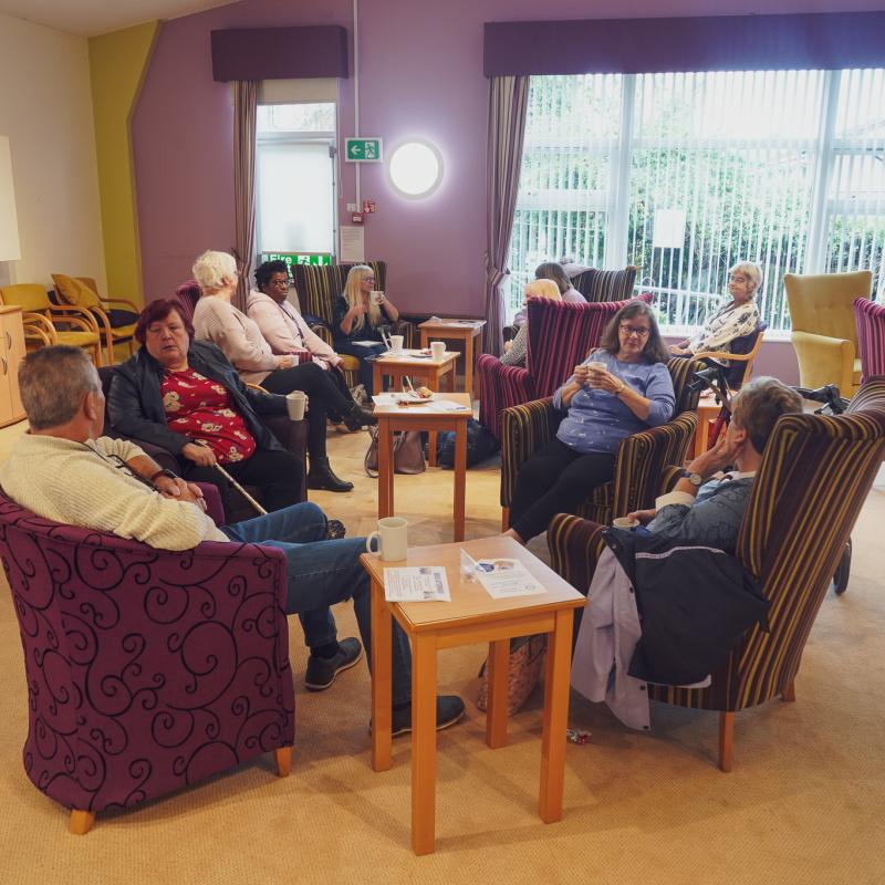 People sat in chairs arranged in a circle